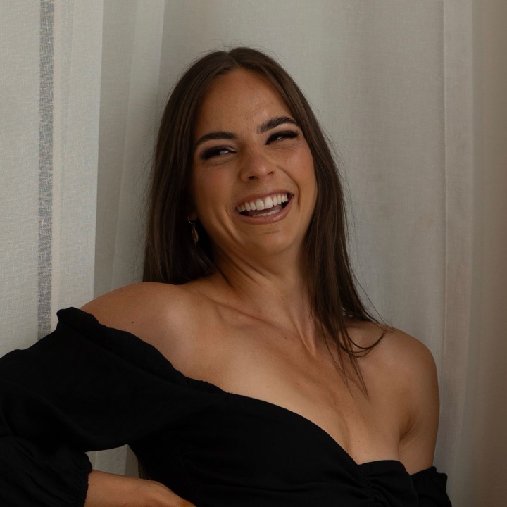 Brooke, founder of Zestara Health, laughing in soft window light